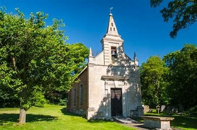 A view of the church at Little Gidding surrounded by trees